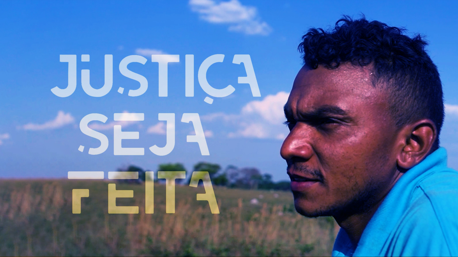 Imagem mostra o perfil de um homem negro ao fundo uma paisagem com mato e o céu azul;  tem ainda a frase  Justiça seja feita escrita em letra branca