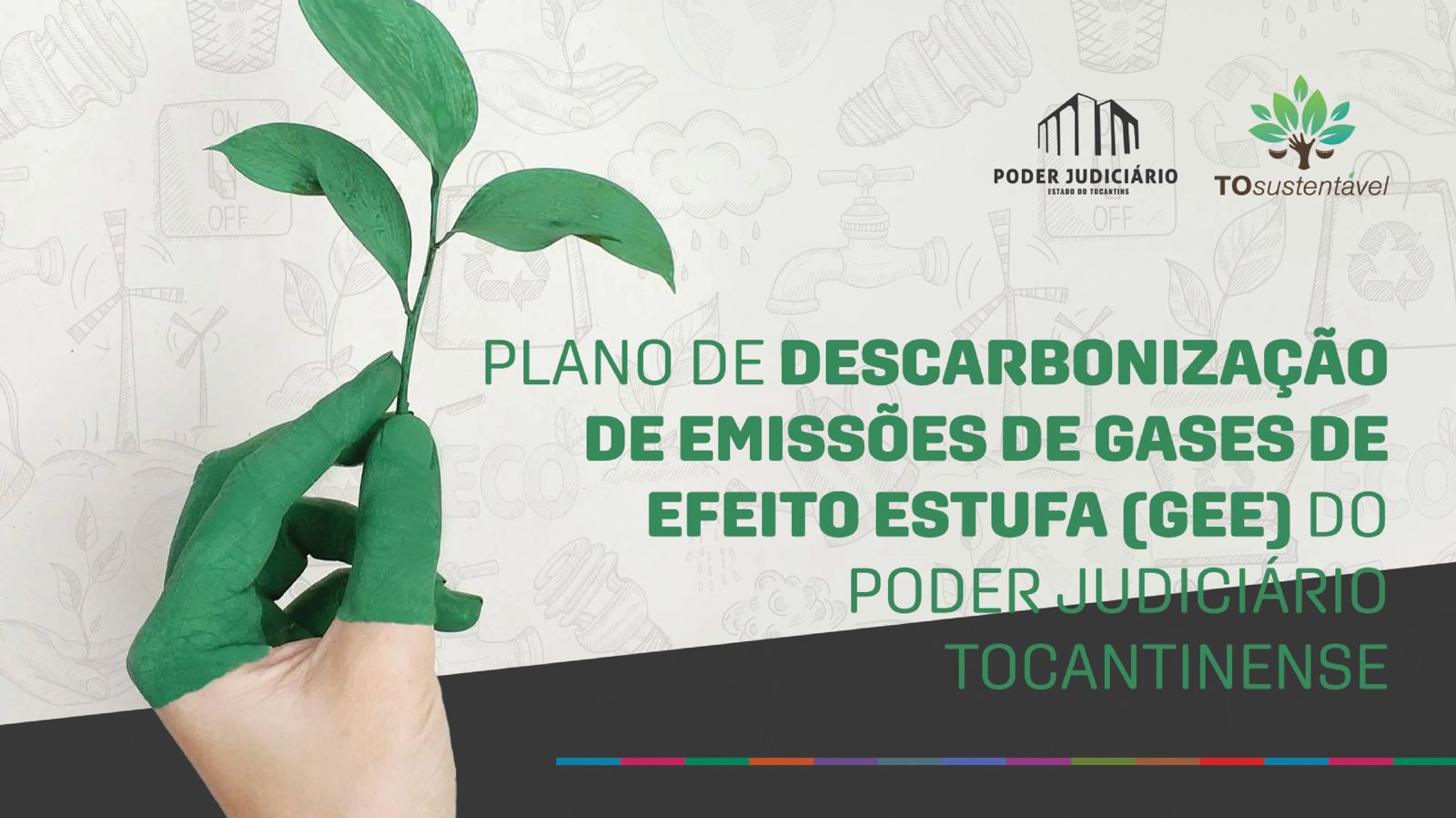 Imagem de uma mão com tinta verde segurando uma folha, com os dizeres: Plano de descarbonização de emissões de gases de efeito estufa (GEE) do Poder Judiciário Tocantinense.